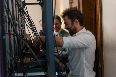 Engineers commissioning a lift control cabinet